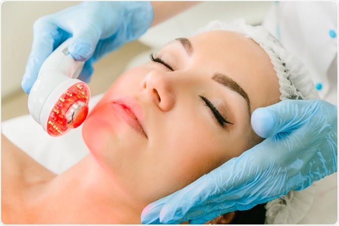 woman having infrared light therapy on face - dermatology application - a photo by Lyudvig Aristarhovich