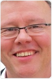 Dr. Neil E. Lewis Biography Image