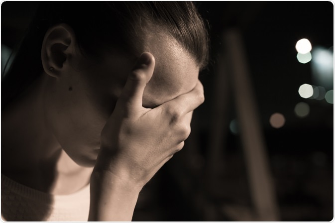 Woman with Major depressive disorder - head in hands