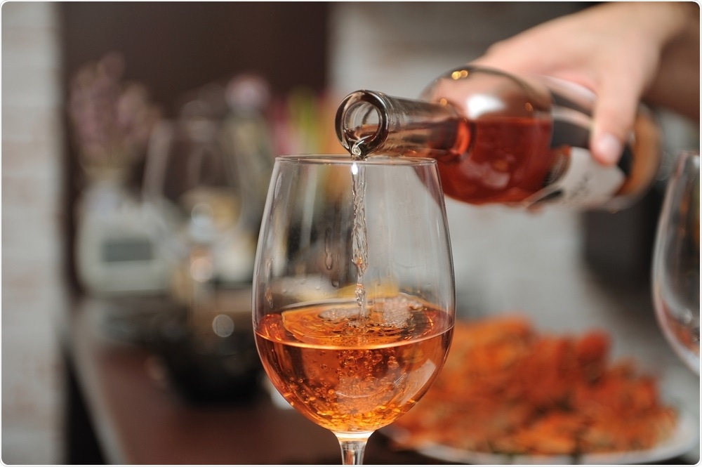 Alcohol - wine is poured into glass