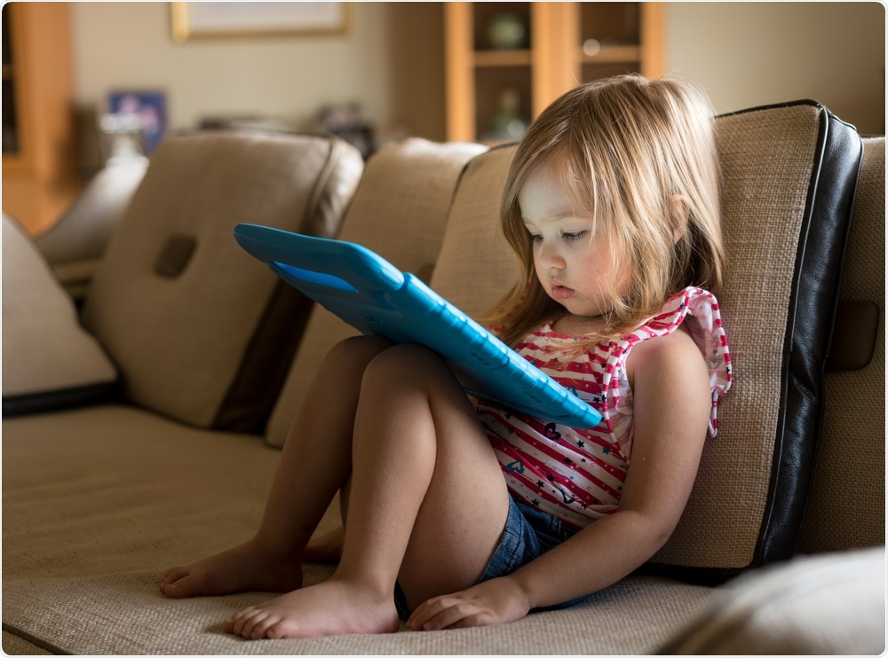 Child in front of screen
