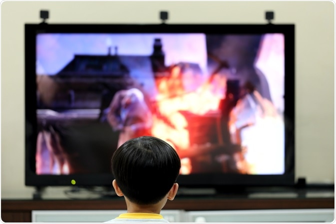 Child in front of screen