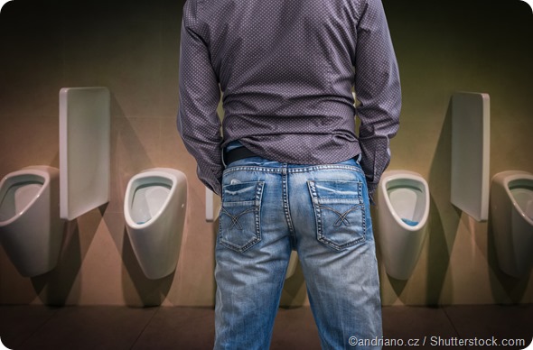 Man peeing urinal