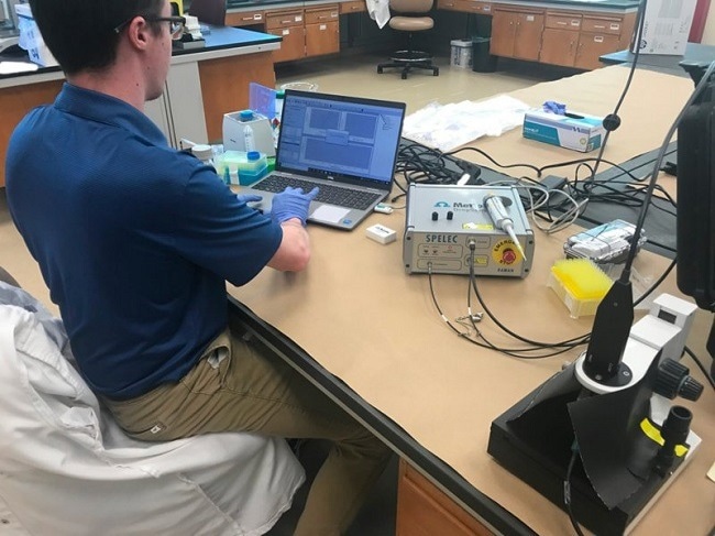 Dr. Colby Ott using SPELEC RAMAN in combination with SPEs for his research on fentanyl detection.