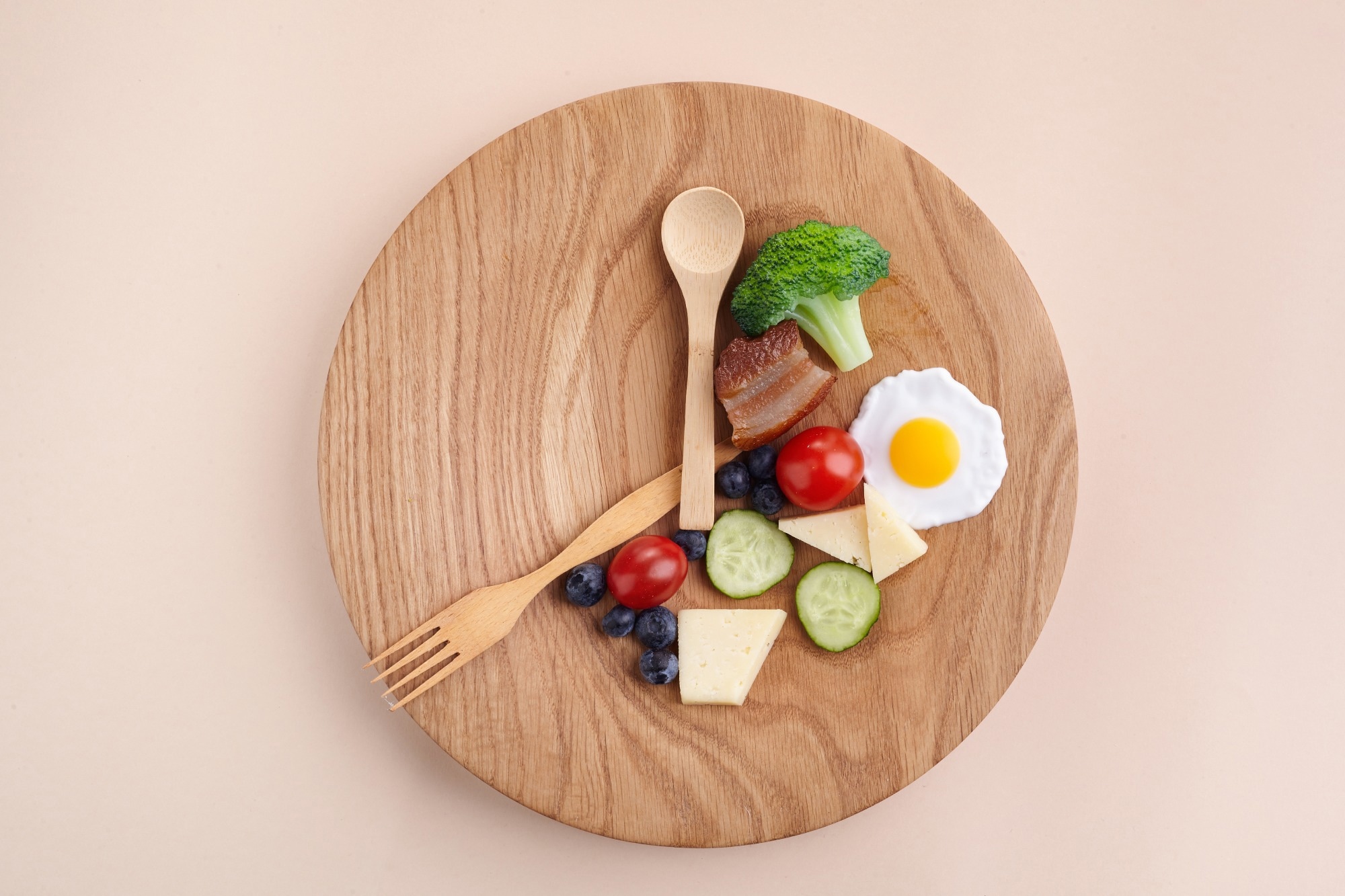 Food on a plate arranged in the shape of a clock