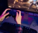 Brain implant decodes finger movements in paralysis patient, enabling video game play