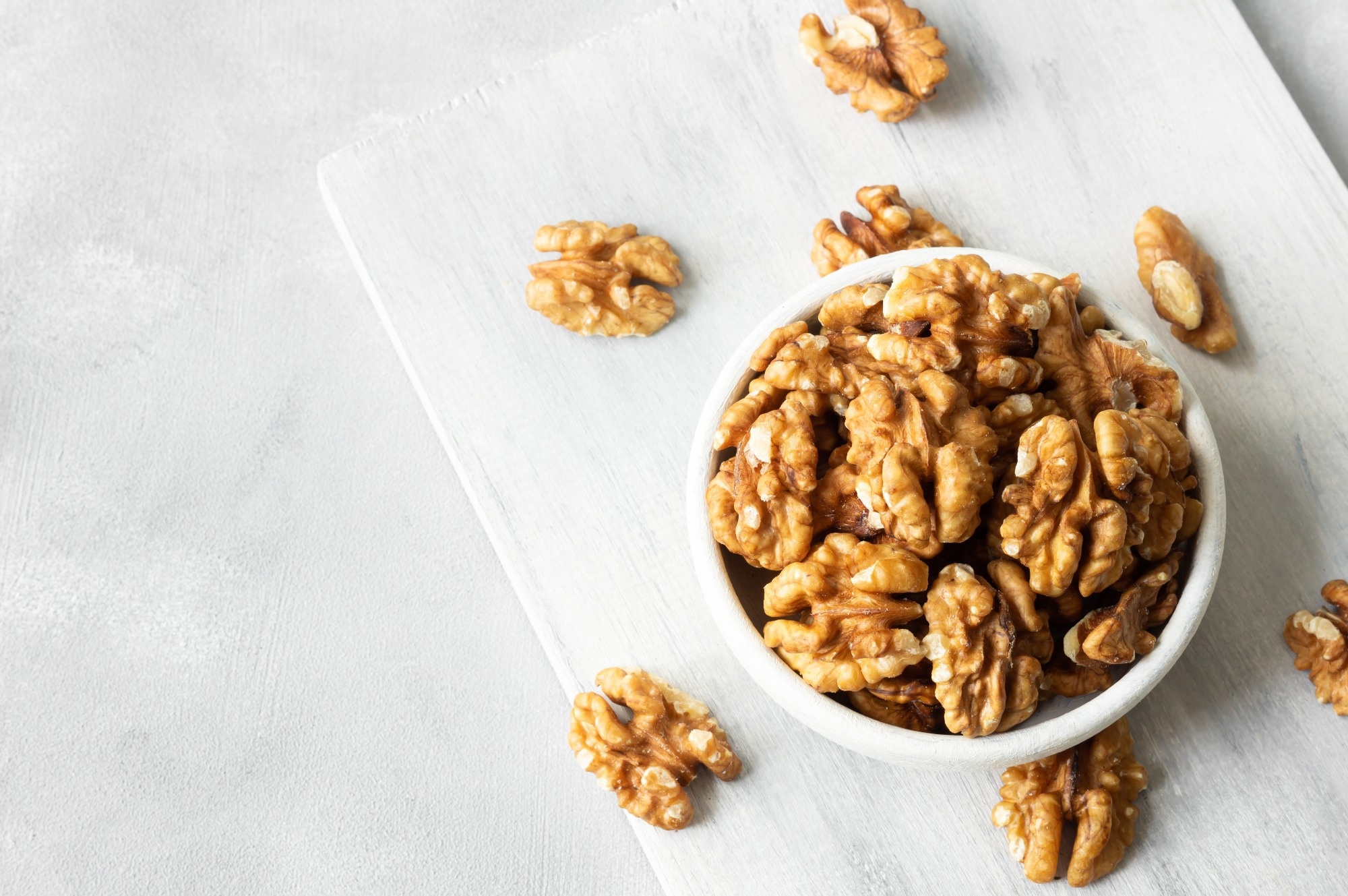 Ripe and fresh walnut kernels in bowl